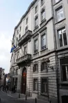 Arrêté du Gouvernement de la Région de Bruxelles-Capitale du 9 février 1995 portant classement comme monument de certaines parties de l'Hôtel de Limminghe sis rue du Chêne, 20 et du Palais du Gouverneur de la province de Brabant sis rue du Lombard, 69 à Bruxelles